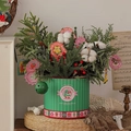 Christmas tree tabletop decor with Noble Fir branches, cotton, and bells in a green box - Forest Nobellis Pine Cotton Tree Bucket (With LED String)