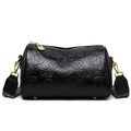 Detail view of black embossed flower cylinder bag with ethnic colorful woven strap - Black