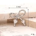 Silver bow shoe charm with heart gemstones showing dimensions 2.6cm x 2.6cm and 4.5g weight - Double Heart Bow White