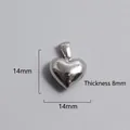 Detailed view of silver heart pendant with dimensions 14mm width and 8mm thickness - High Polish Heart Pendant (P00028S)