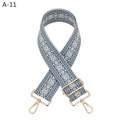 Detail of adjustable woven purse strap with geometric diamond pattern and gold hardware - Lake Blue