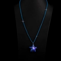 Handmade blue beaded necklace with a sparkling star-shaped resin pendant on black display - Blue