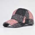 Close-up of pink and black plaid baseball cap with fuzzy texture and curved brim - Adjustable / Spliced Pink Grey