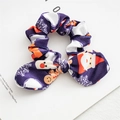 Close-up of Christmas scrunchie with rabbit ears and holiday prints on dark blue fabric - Dark Blue Snowman