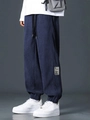 Men's dark blue corduroy cargo pants featuring elastic waist and drawstring design - Dark Blue