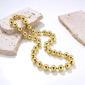 Collier à billes minimaliste en or 18 carats sur pierres de travertin beiges - Doré