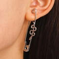 Silver safety pin earrings with textured snake design on model for unique look - White K Single Snake Pin Earring (7755)