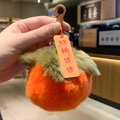 Detailed plush persimmon keychain with orange velvet texture and lucky charm tag - Persimmon Endless Good Luck