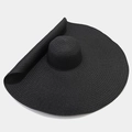 Close-up detail of high-density black straw weaving on a large brim sun protection hat - One Size / Black