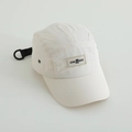 Detail of cream 5-panel camper cap showing a bear label and breathable metal eyelets - Off White