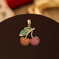 Exquisite cherry pendant with green leaf and colorful crystals on leather surface - Gold Colorful Zirconia Cherry