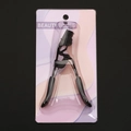Professional black eyelash curler with comb for natural curling in blister packaging - Electrophoresis Black Curler with Comb Black Duckbill Handle Black Rubber Pad Blister Card Pack