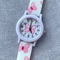 Detailed top view of white silicone kid watch with pink butterfly print on felt background - White