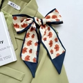 Floral print long silk scarf in cream and orange tied as a bow on a green blazer - Navy Blue Small Red Floral