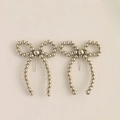 Silver bow stud earrings with beaded texture and elegant faux pearl minimalist style - Silver
