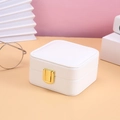 Single-layer white jewelry storage box with gold lock on pastel background - White