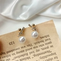 Elegant gold bow earrings with white zircons and hanging pearl on vintage background - Classic Zirconia Pearl (A114)