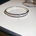 Detail of silver-plated hulu bangle with double-row cubic zirconia inlay on white surface - Hulu Design With Zirconia (4#)
