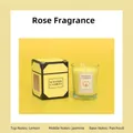 Lemon scented candle in glass jar with yellow gift box featuring jasmine and patchouli notes - Lemon / Yellow