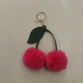 Cute peach pink cherry keychain with faux fur balls and green leather leaves on gold ring - Strawberry Red
