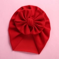 Detail of red baby turban hat with a large soft bow on a pink minimalist background - 18*21cm / Red
