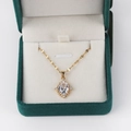 Detail of a gold-plated cross necklace with a large crystal pendant in a green gift box - Vintage White Halo Style 5 / Gold