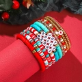 Close-up of Christmas polymer clay beaded bracelets with JOY, HOLLY, and MERRY letter beads - SY0311-1 (Red Green Gold Multi-layer Set)