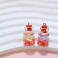 Miniature bottle charm with red cap featuring colorful glitters and stars inside - True Red Wish Bottle