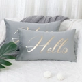 Grey velvet lumbar pillow covers with golden Hello embroidery on a soft white plush rug - Grey Hello Gold Bronzing