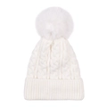 Detail of chunky cable knit white beanie with large faux fur pom-pom and ribbed cuff - White