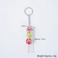 Miniature tricolor sugar-coated hawthorn keychain with wood stick and sesame details - 7.5cm Sesame Red Green Candied Haws - Keychain