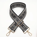Detail of bohemian black and gold woven bag strap with geometric patterns and metal hooks - Grey With Black Base