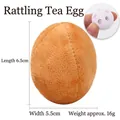 Brown tea-egg plush dog toy with internal bell squeaker measuring 6.5cm in length - Egg