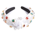 Detail of white knotted fabric headband with inlaid pearls and colorful gemstones - White