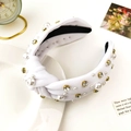 Detail of white knotted headband featuring elegant pearls and sparkling rhinestones - Pure White
