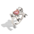 Silver bow ring with pink heart gemstone and polished finish on white background - US 7 / Steel