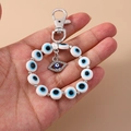 Beaded Evil Eye keychain with a sparkling crystal eye and silver metal clip - White Rhinestone Eye