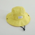Detail of yellow kids bucket hat with 'Go' embroidery, breathable vents and chin strap - 52cm / Yellow