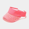 Close-up of bright pink sun visor with colorful rhinestones and 100% polyester label - Adjustable / Pink