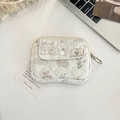 Close-up of quilted floral card holder with rabbit pattern and metal keychain ring - Rabbit Paradise