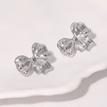 Boucles d'oreilles nœud en acier inoxydable argenté sur plateau en céramique - Couleur Acier