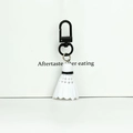 Badminton shuttlecock keychain with white body and black metal carabiner clip - Door Buckle White Badminton