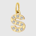 Macro shot of gold letter S pendant with clear zircon inlay and polished steel finish - Letter S
