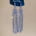 Detail of silver needle earrings with purple crystal hearts and long tassel fringes - Purple Hollow Heart Tassel Style