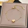 Elegant gold heart pendant bracelet in stainless steel featuring delicate cross chain - Gold Fine Cross Chain Heart Style (5255)