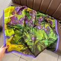 Detail of artistic Van Gogh Iris print on silky square scarf draped on a leather background - Style 4