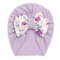 Detail of baby turban featuring light purple fabric and a floral print knot bow - Purple