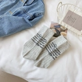 Grey crew socks for women featuring minimalist black typography on the sole - Light Gray