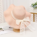 Pink wide brim straw sun hat featuring elegant white lace and floral bow decoration - Lace Plum Wave Pink