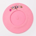 Detailed top view of pink wool beret featuring colorful rhinestone and gemstone embellishments - One Size / Pink